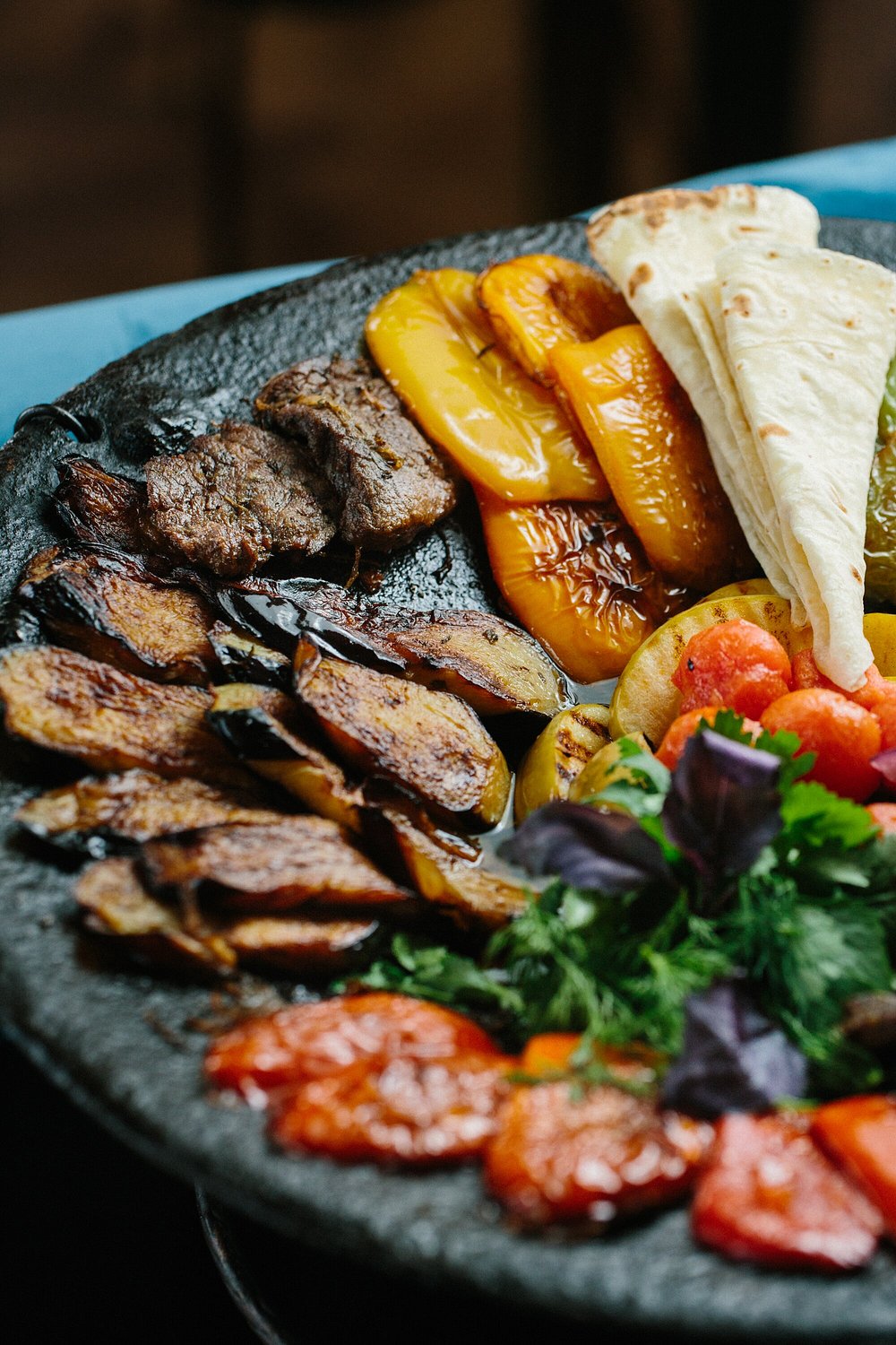 A stone saj of lamb, aubergine, sweet pepper and tomato with lavash at Chayki in Baku