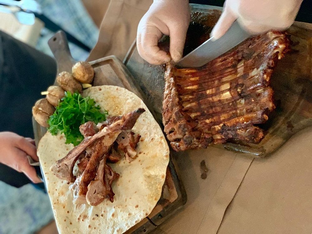 Lamb ribs carved to order onto lavash at Chayki in Baku