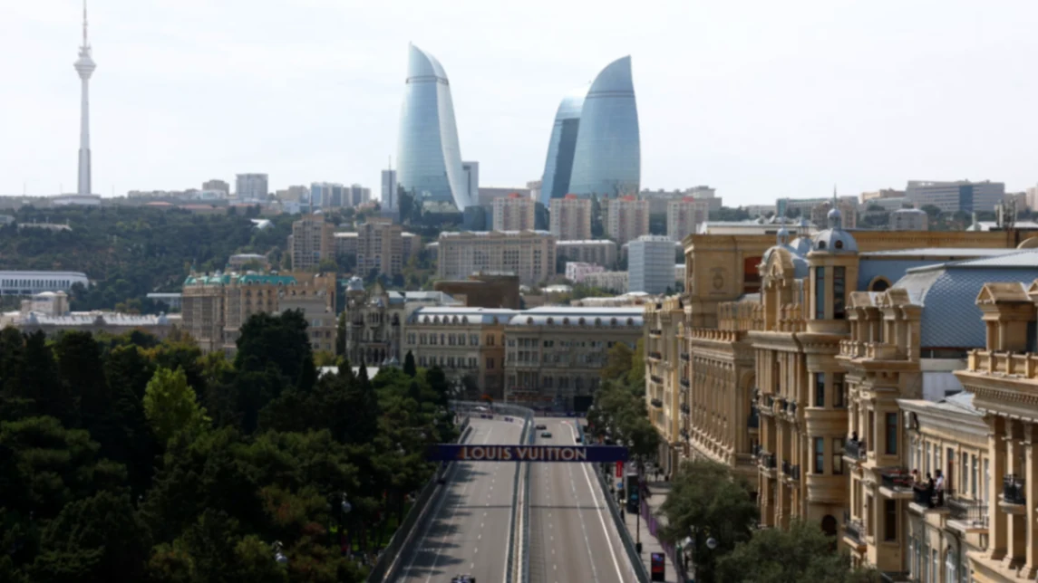 The Baku skyline at midday, with the Flame Towers rising above the boulevards of the historic centre