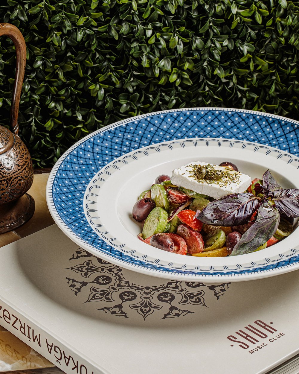 A salad of tomato, cucumber, olive and white cheese with purple basil at Shur Jazz Hall in Baku