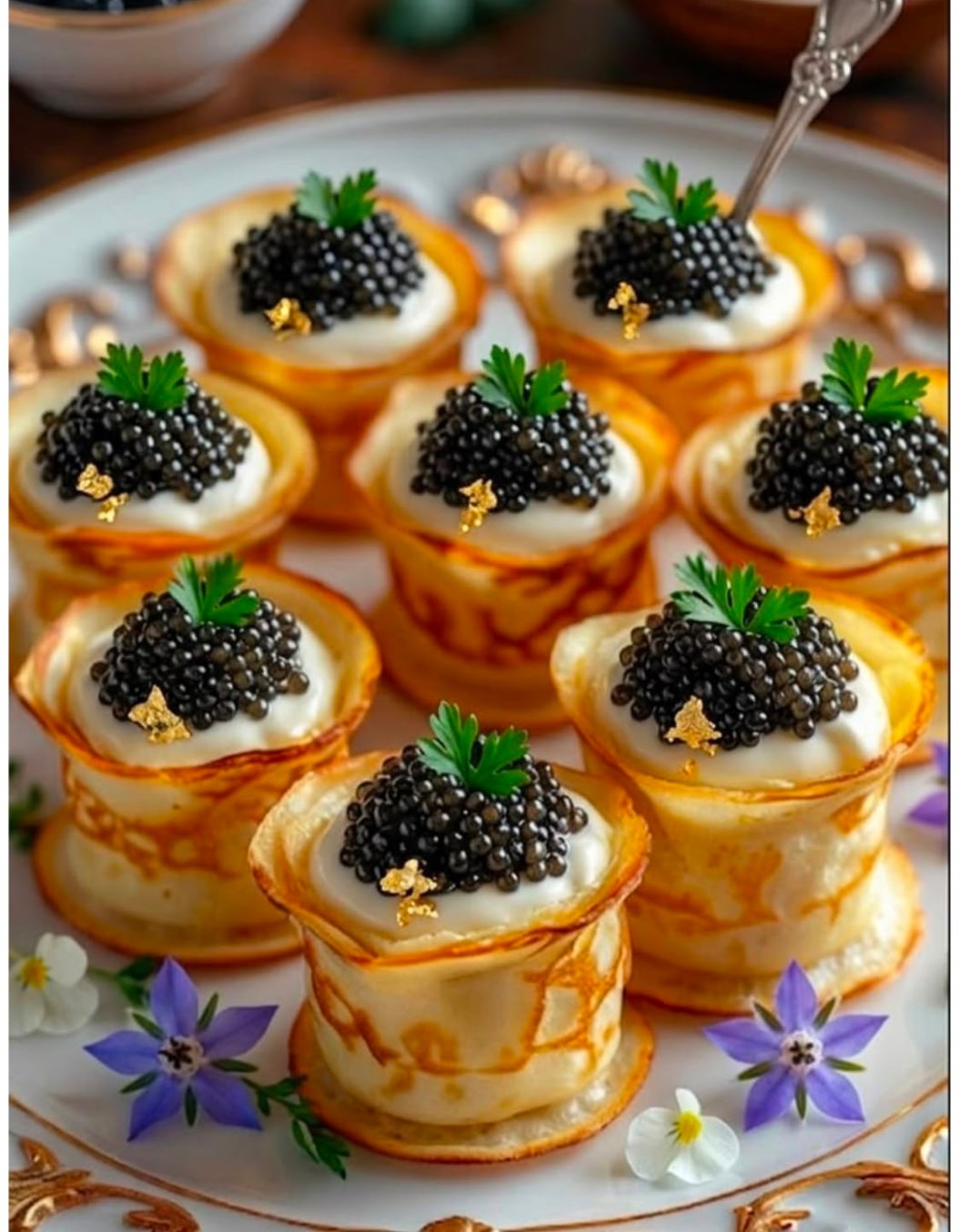 Caviar served on warm blinis with crème fraîche at Merci Baku