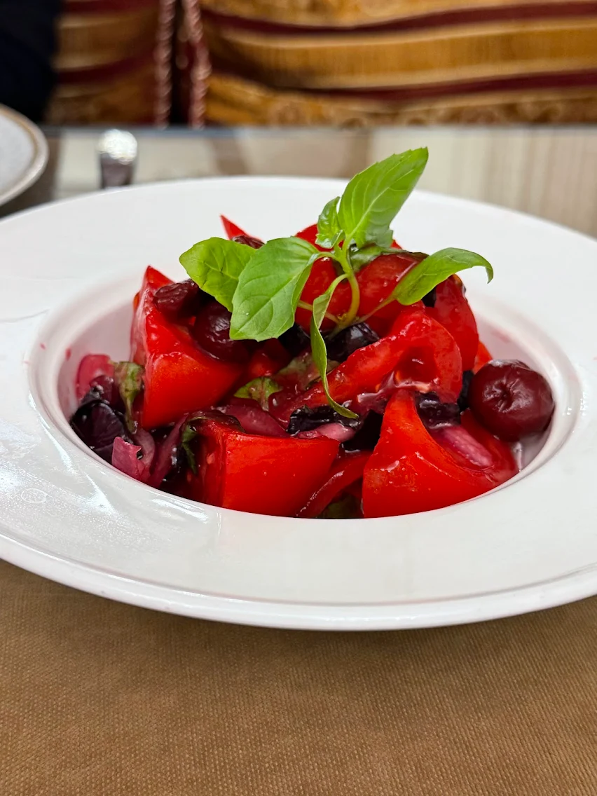 Tomato salad with cherries, red onion and basil at Shirvanshah Museum Restaurant, Baku.