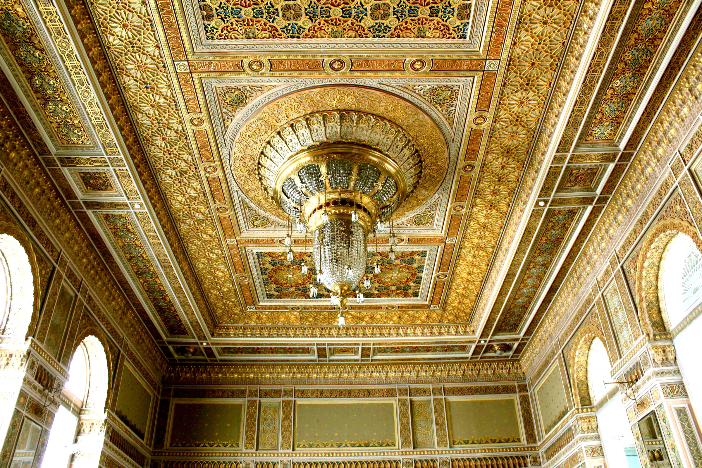 Ornate historic interior of the Taghiyev Mansion in Baku, with painted ceiling and chandeliers