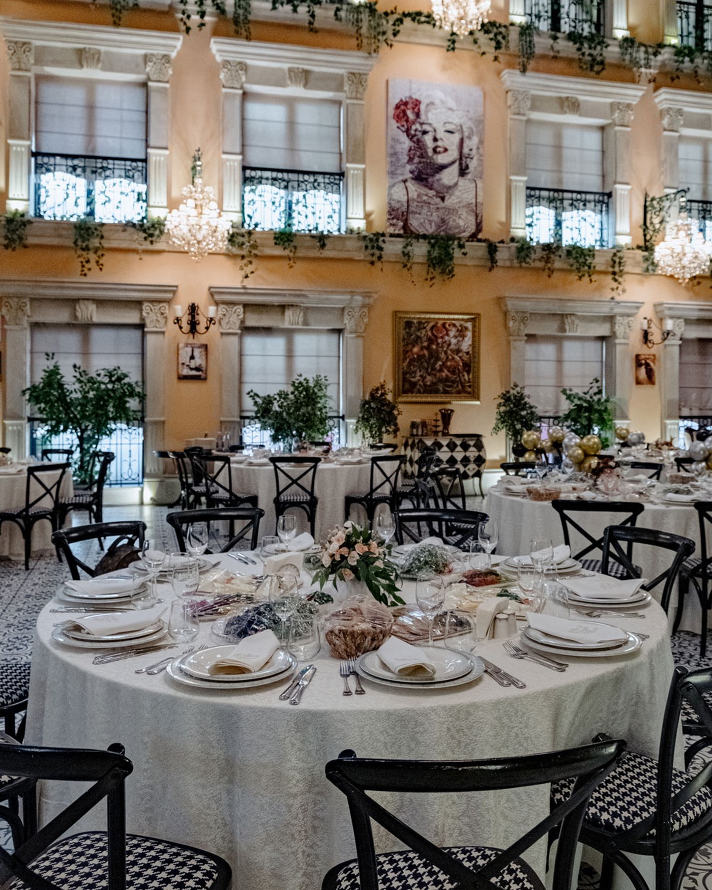 A warm dining room in Baku with long shared tables and soft evening light
